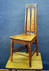 Stickley Brothers early desk chair with heart cut out design and tapered legs.